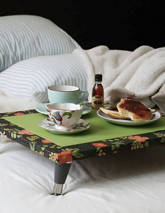 "Breakfast is on the bed with breads and some drinks."