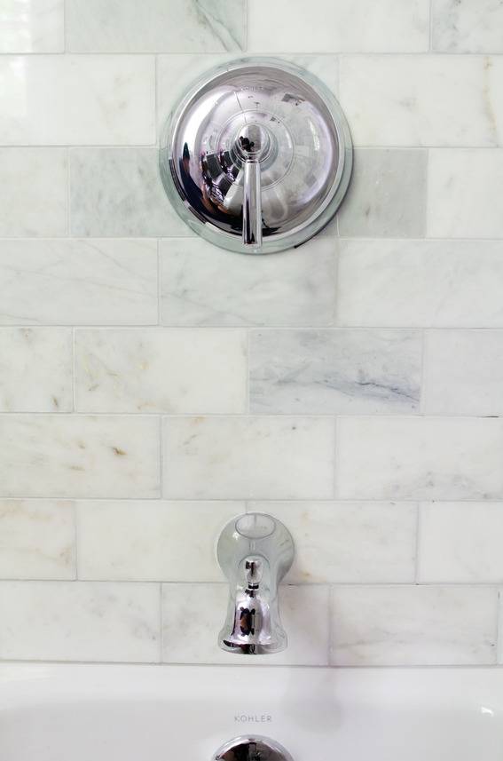 Kohler Bancroft shower fixture with marble subway tile