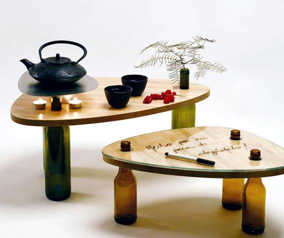 Two coffee tables have wine bottle legs.