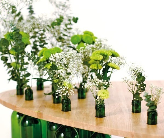 A wine bottle coffee table with flower plants