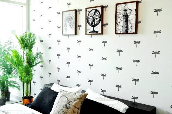"Stamped statement wall design with wall hangings,cushions and plants at the corner."
