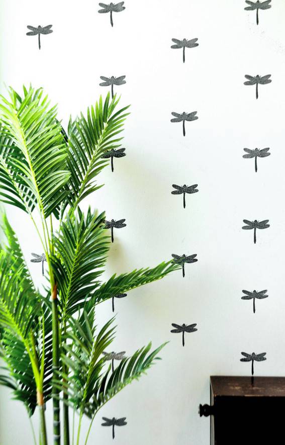 "Stamped statement wall design with plant."