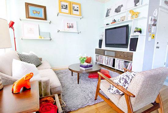 "Living room with photo frames and home products."