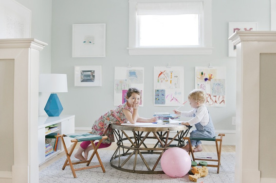 "Kids crafting room with charts,ball and nightstand."