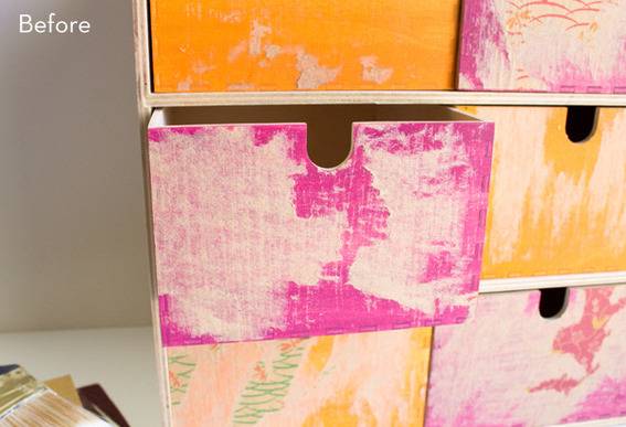 Pink and yellow drawers are in an organizer.