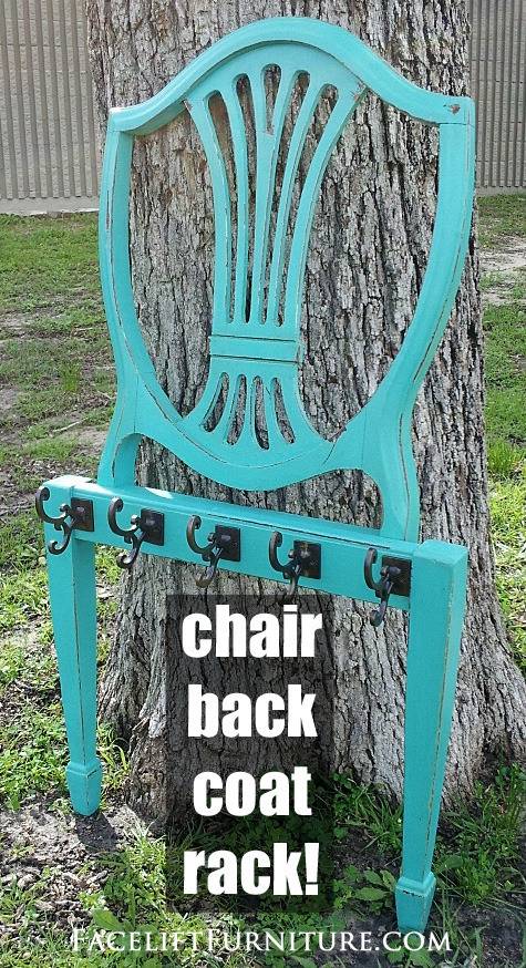 A teal metal chair back leans up onto a tree.