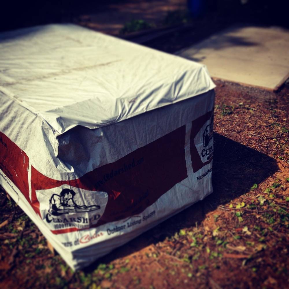 A red and white package is on the ground.