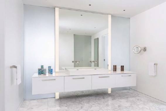 A clean white bathroom with minimal decor.