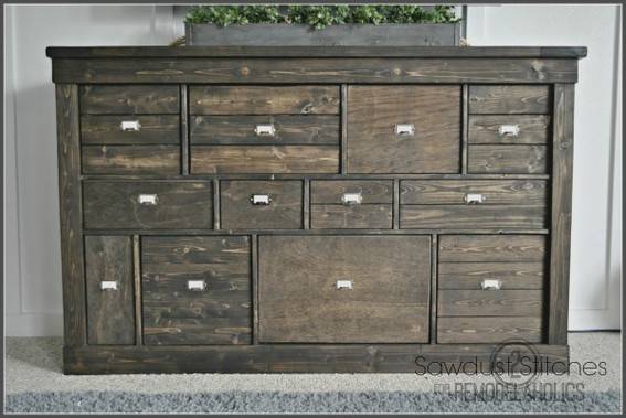 Wooden cabinet with many drawers.