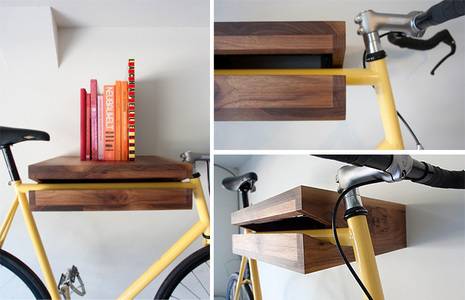 A wooden shelf with an opening that holds a yellow bike bar, a part of a wooden shelf with the opening hold a bike bar, the side of a wooden shelf with an opening that is holding a yellow bike bar.