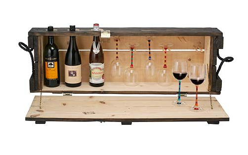 Bottles of wine and wine glasses are arranged in a case.