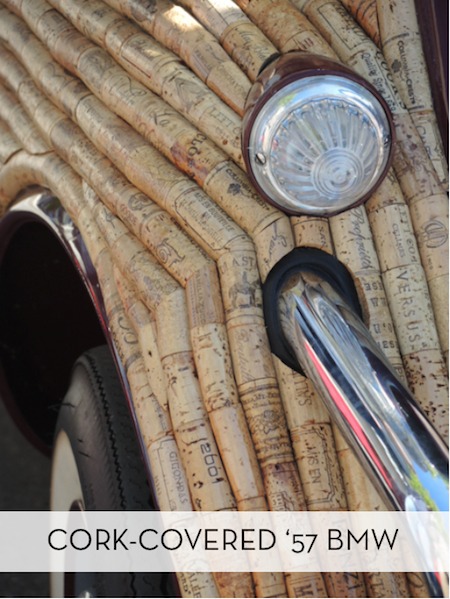 A wooden structure has a plastic tube going into it.