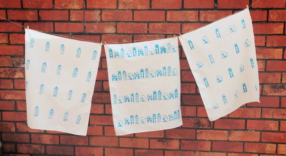 "White and blue designed fabrics hanging on the rope."