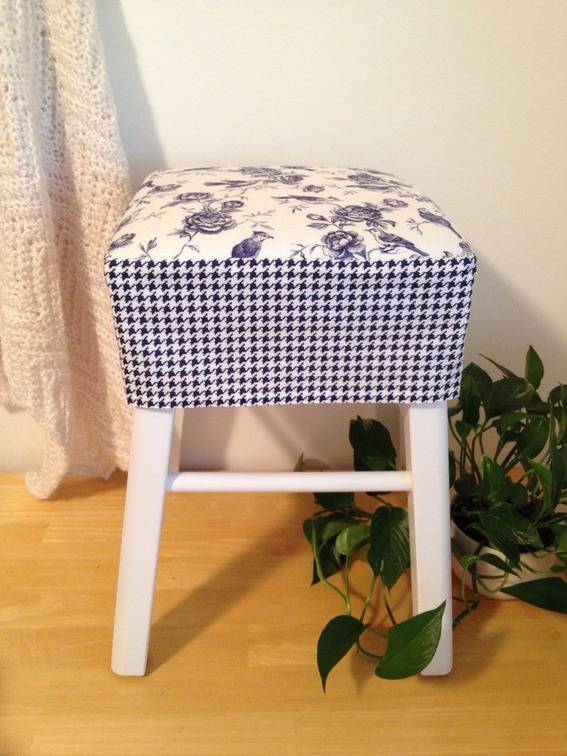White stool seat covered with checks fabric.