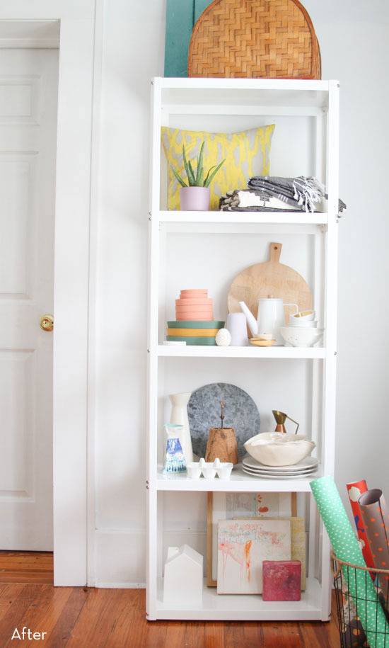 A tall white shelving unit reduces clutter.