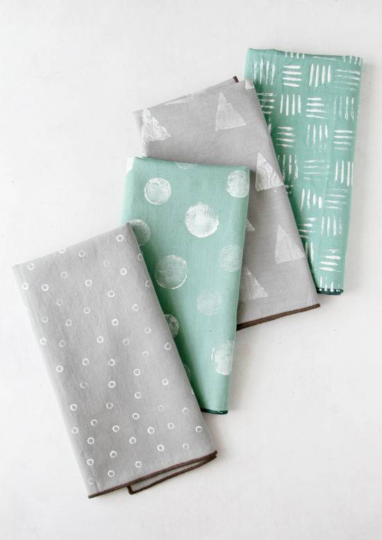 Triangles, lines, and dots on Gray and teal napkins.