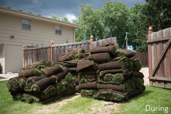 Rugs are stacked up to makeover a deck.