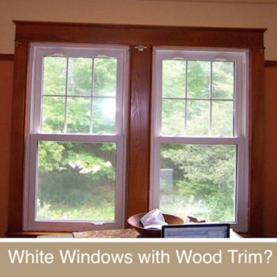 Wooden windows looking out to the trees.