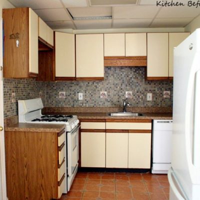 Appliances and cabinets line the walls of a kitchen.