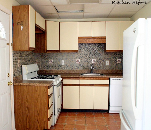 Appliances and cabinets line the walls of a kitchen.