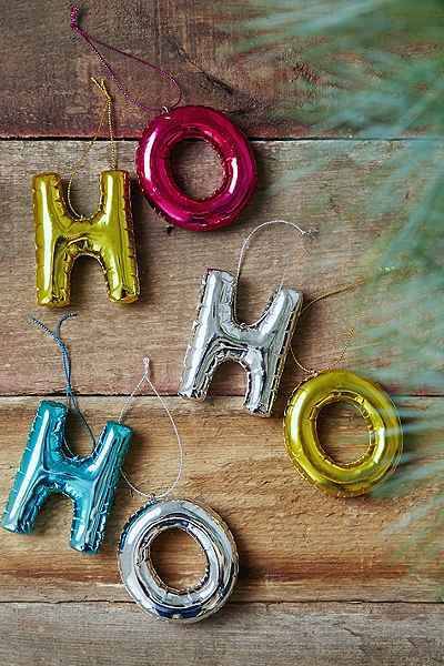 Three ornaments spell out "HO HO HO".
