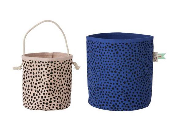 A small fabric pot is next to a larger blue one.