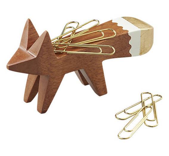 A wooden paper clip holder is shaped like a fox.