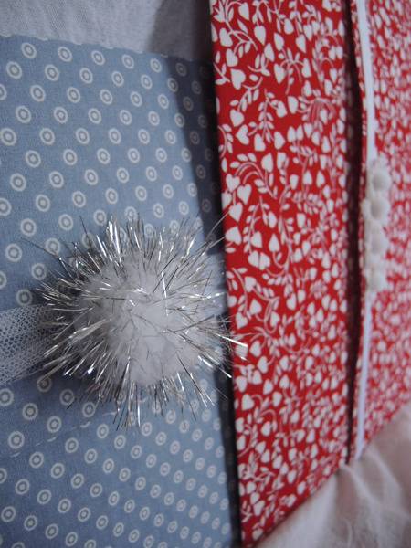 "Tulle and a sparkly pom pom and few fabric gift envelopes."