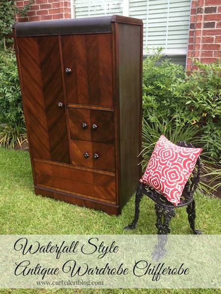 A wooden wardrobe stands on a lawn.