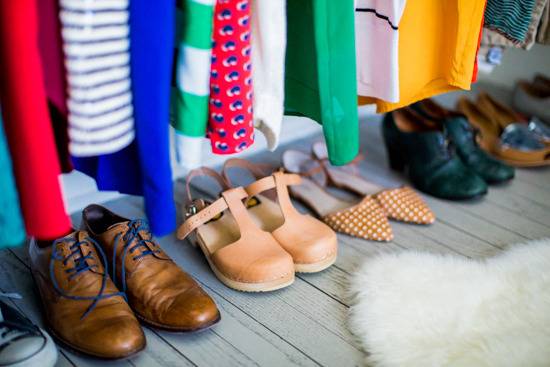 "Closet with organized dresses and shoes."