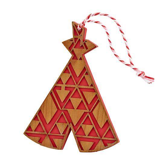 An ornamant with red and wood shaped designs.
