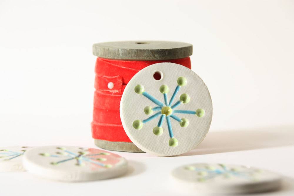 A sewing kit sitting on top of a white table.