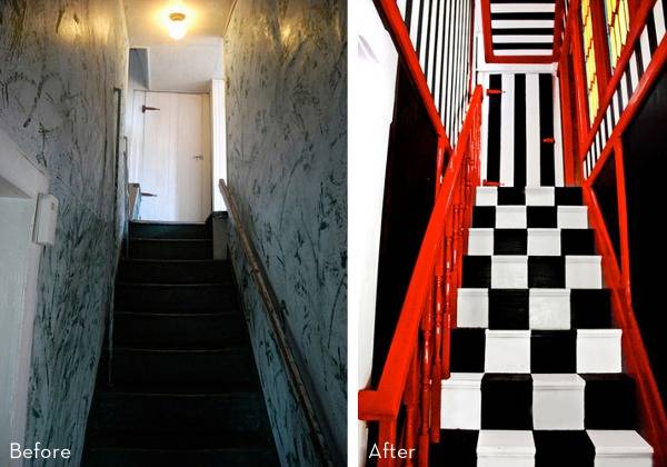 " A Black and White Stairs with Red Rails"
