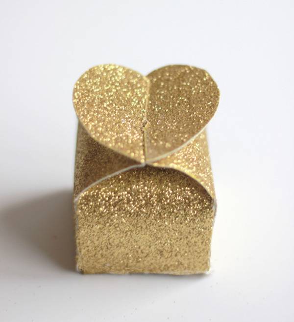 "A Gift Box Wrapped with Gold Colored Paper"
