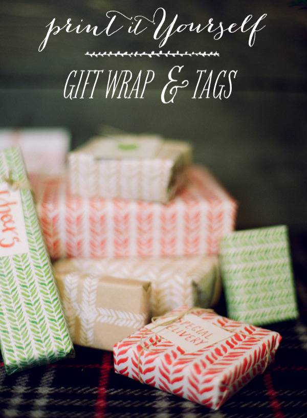 A haphazard stack of boxes neatly wrapped in red or green printed paper, some with gift tags.