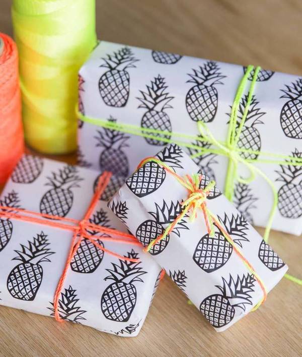 Packages have been wrapped in white and black pineapple wrapping paper.