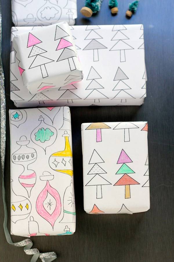 Christmas trees and ornaments drawn and painted on white paper to look like vintage 1970*s styles drawings are used to cover boxes as wrapping paper.
