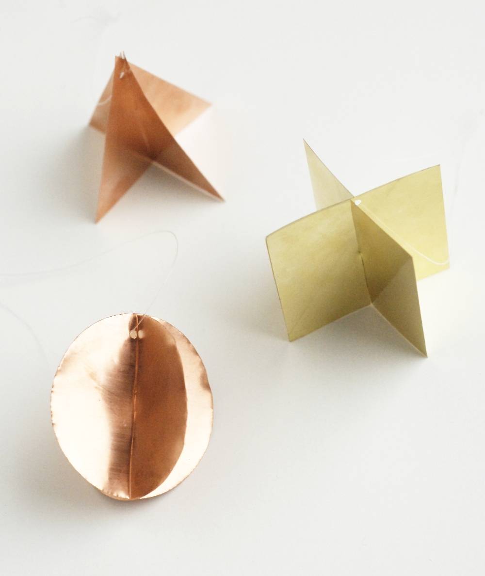 three piece of copper and brass geometric ornaments