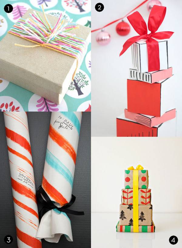 A tan gift box tied with multi colored string, two cylindrical packages wrapped in orange striped paper, a stack of square boxes that are black and white and orange with a red bow on top and a stand of decorated brown boxe tied together with a yellow ribbon.