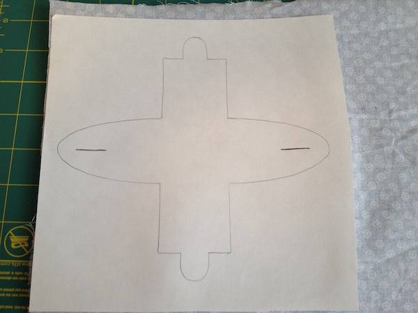 Disc shaped drawing on piece of paper on top of tissue paper.