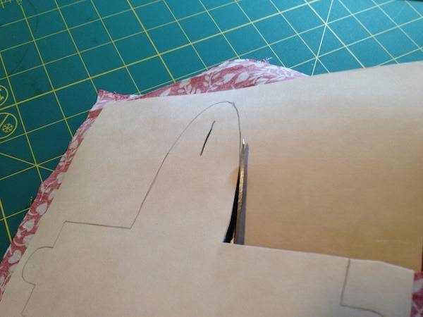Cutting out cardboard for a fabric gift box.