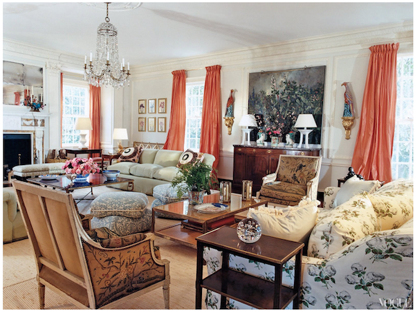 Group of sofas around a coffee table in a living room.