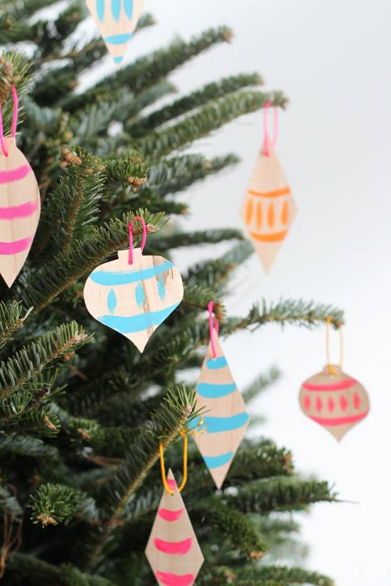 Decorated ornaments are hanging on the Christmas tree.