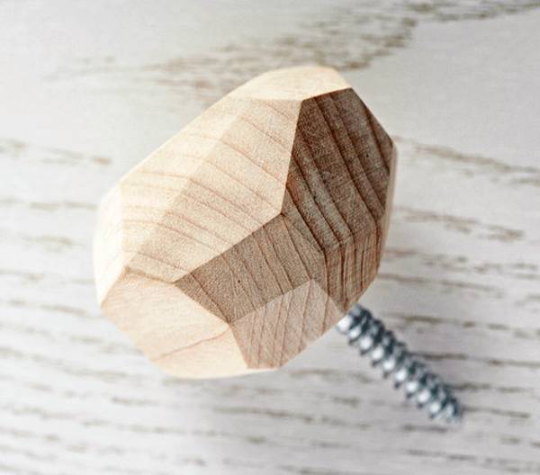 Small screw with a wooden head used to create wall hooks.