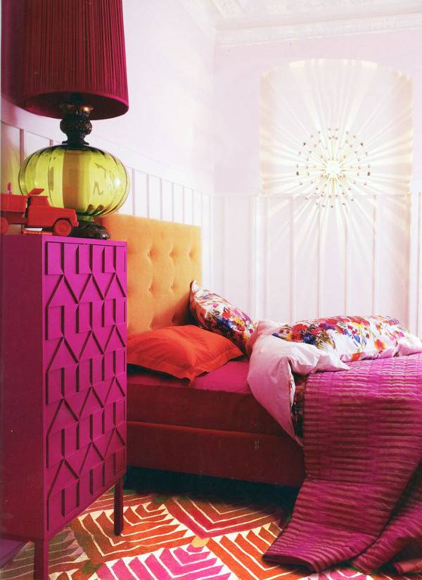 A bedroom in various shades of pink.
