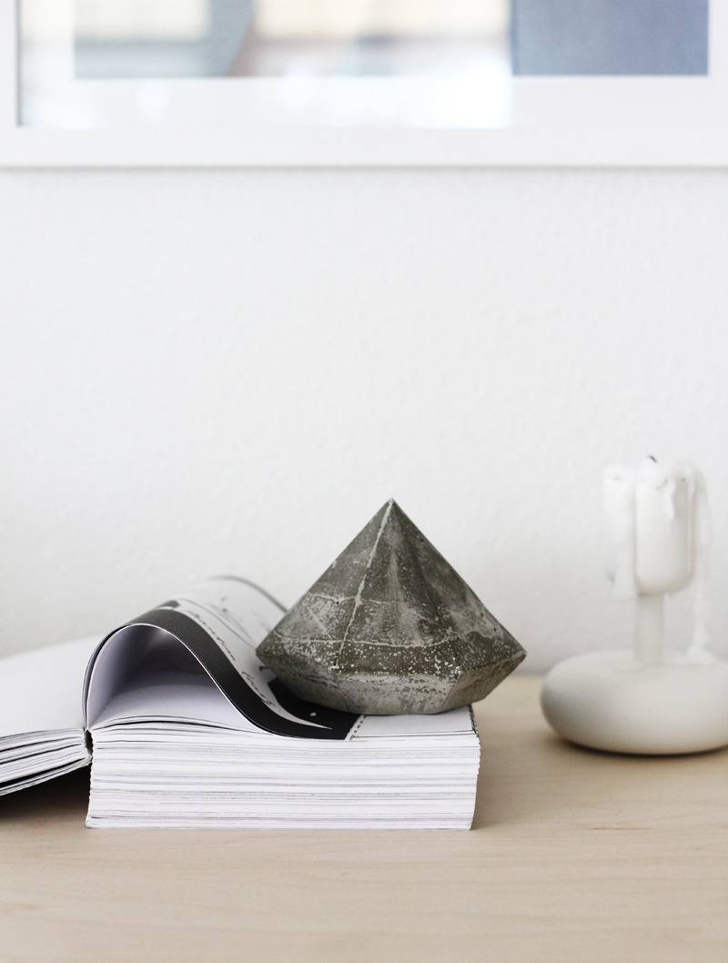 A white desk with books and office accessories