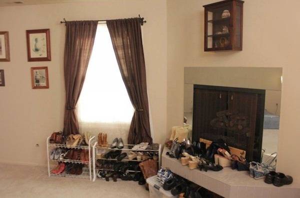 Rustic bedroom with a fireplace and set full of shoes
