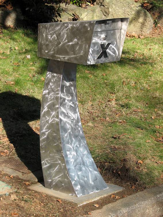 Stainless steel mail box at the side of the open area.