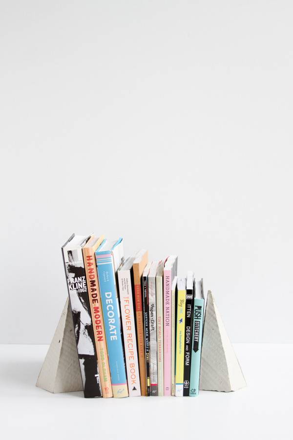 A stack of books held up by bookends.