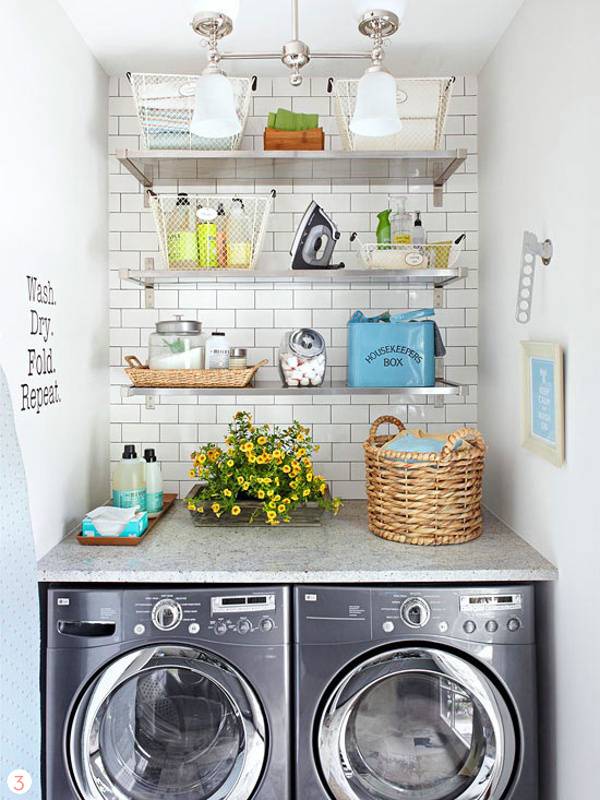 Laundry with a washer and dryer and three shelves on top